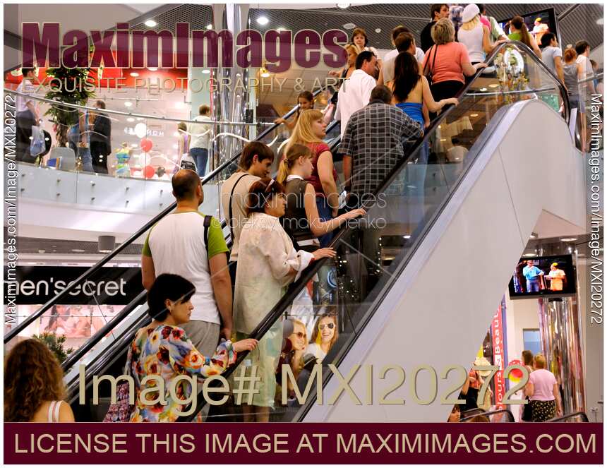 People on Escalator in Shopping Mall