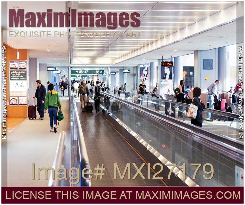People on moving walkway at an airport