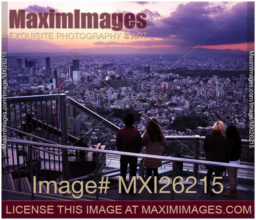 People on observation deck during sunset in Tokyo Japan