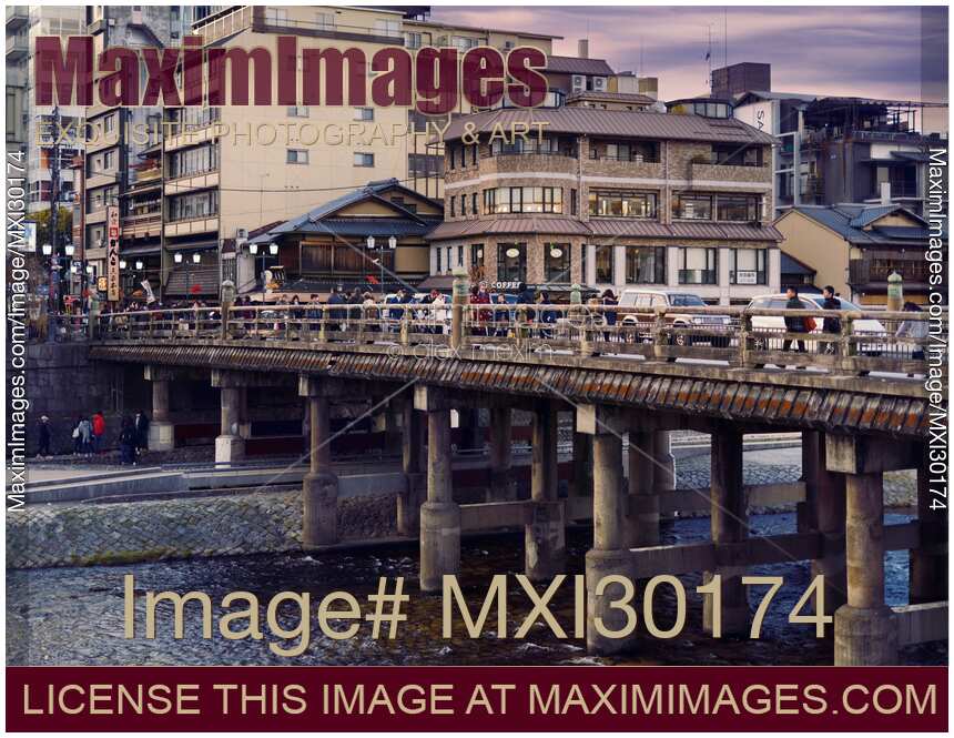 People on Sanjo bridge over Kamo River sunset scenery in Kyoto Japan