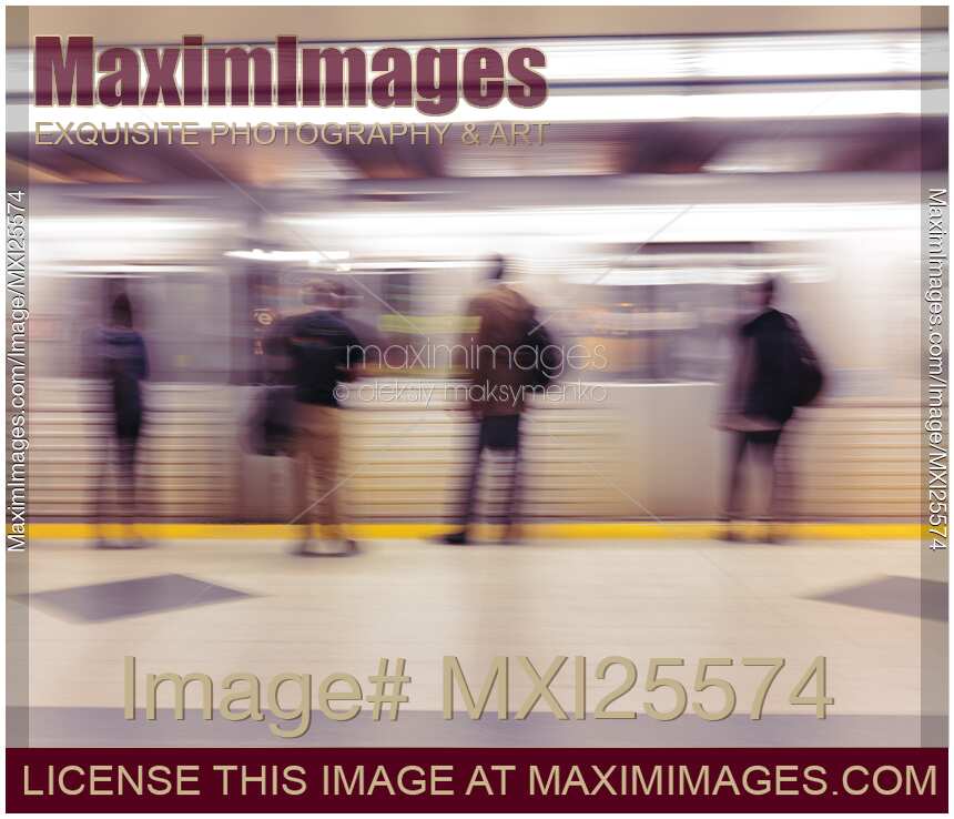 People on subway platform and arriving train