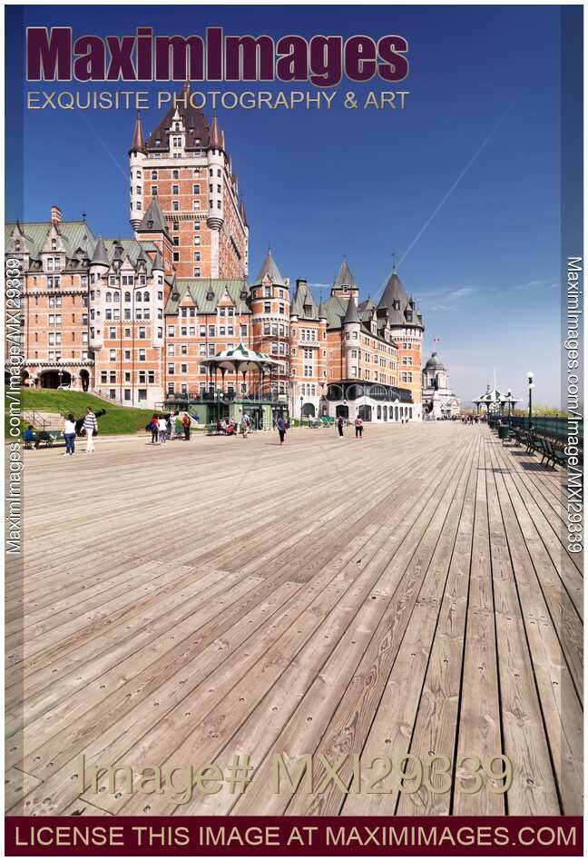 People on Terrasse Dufferin boardwalk near Fairmont Le Chateau Frontenac castle in historic old Quebec city