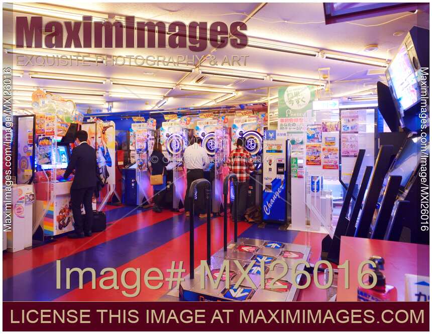 People playing arcade slot machines in Japan