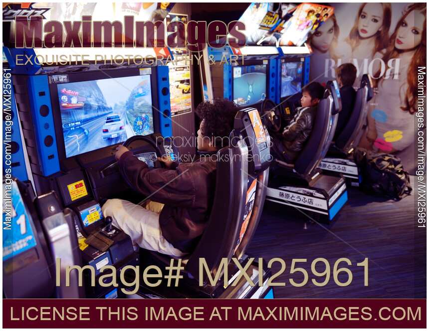 People playing at arcade in Japan