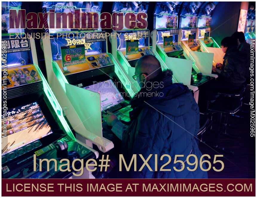People playing Border Break arcade slot machines