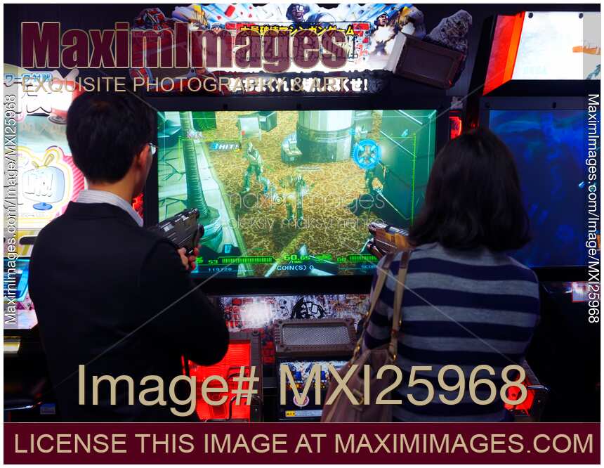 People playing Razing Storm arcade slot machines