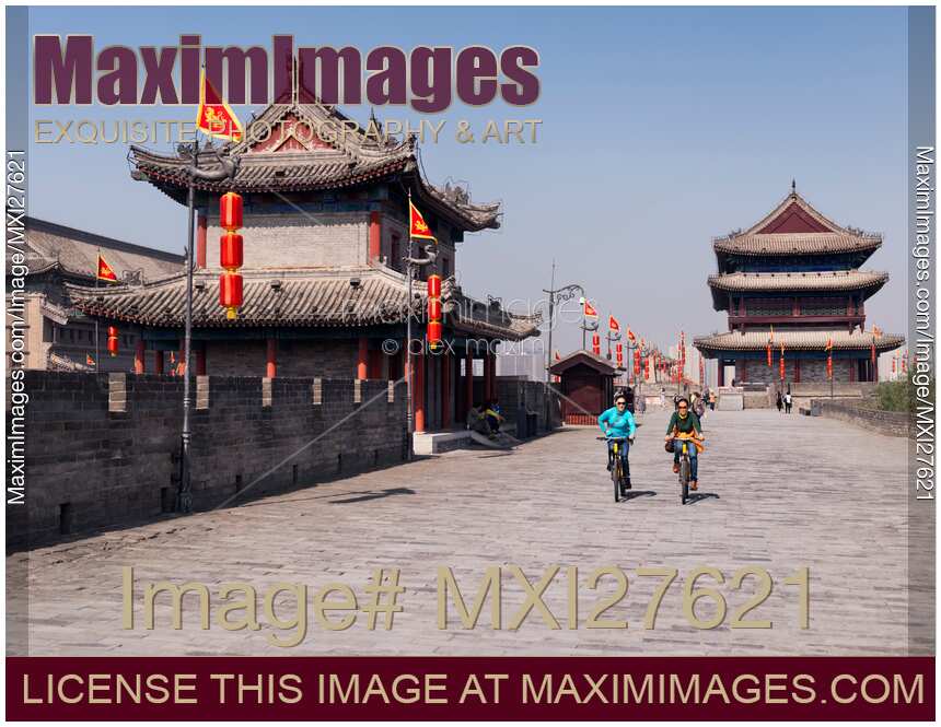 People riding bikes on Xi'an city wall in China