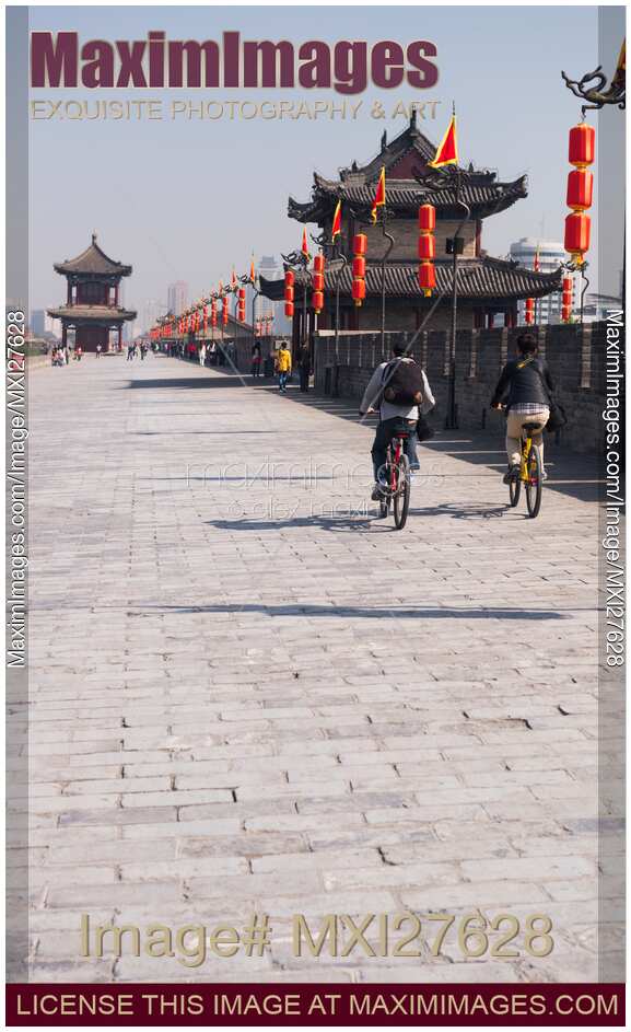 People riding bikes on Xi'an city wall in China