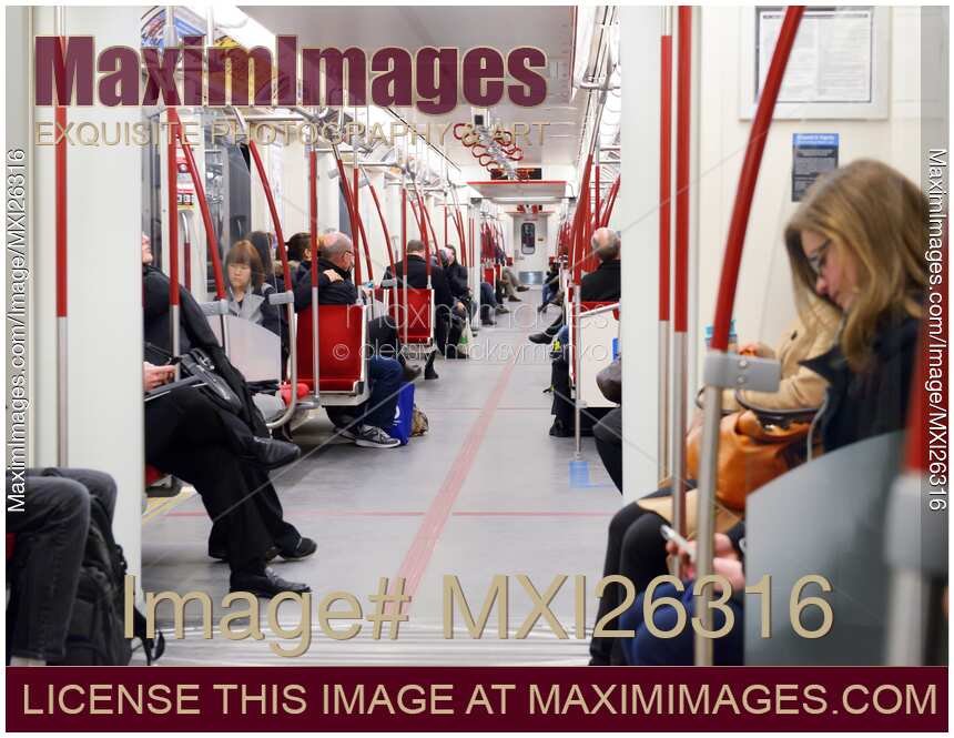 People riding subway train