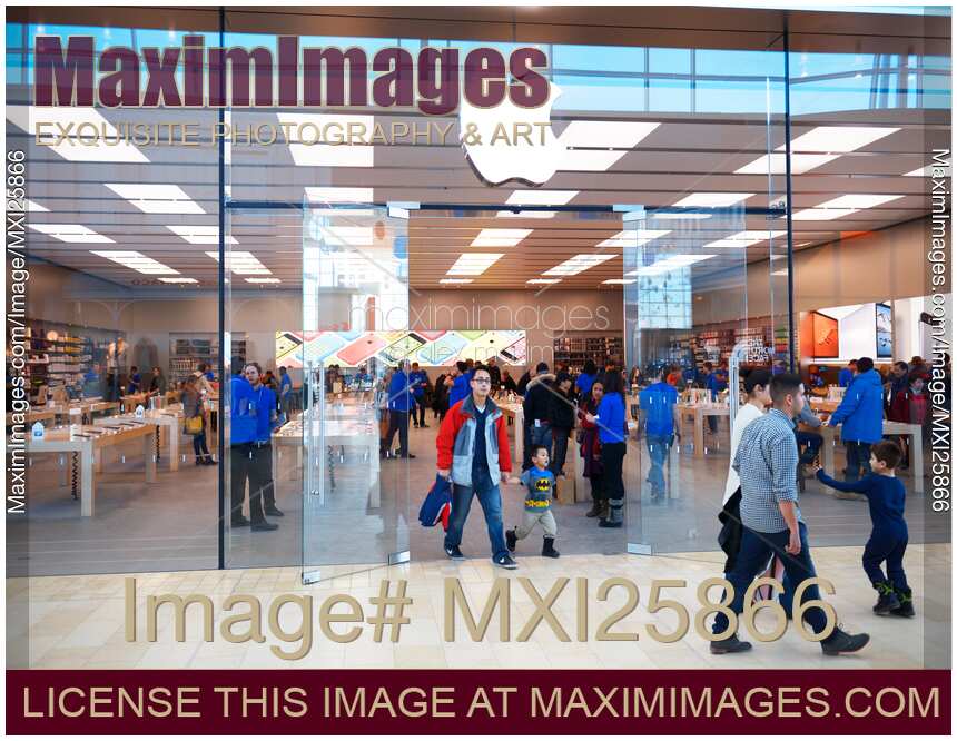 People shopping at Apple store in Canada