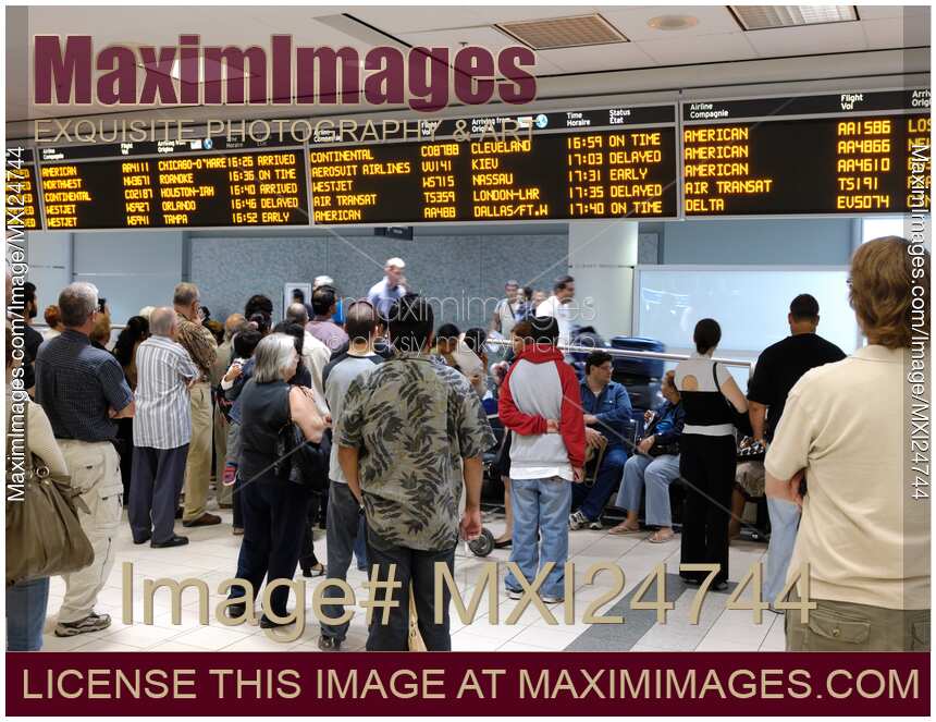 People Waiting at Airport Arrivals Hall