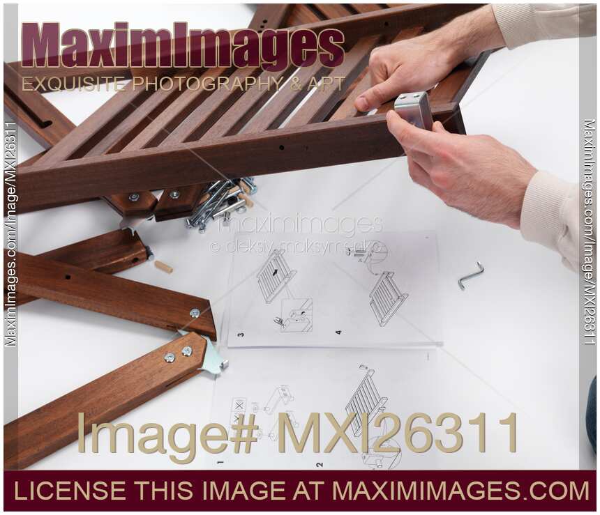 Person assembling IKEA furniture parts