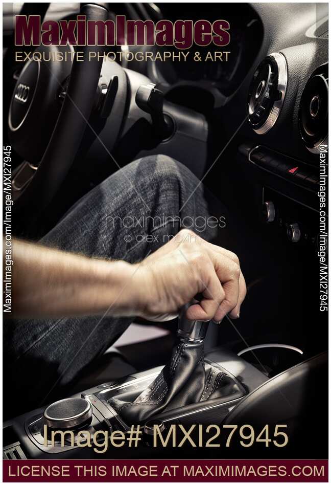 Person hand on a car gear stick