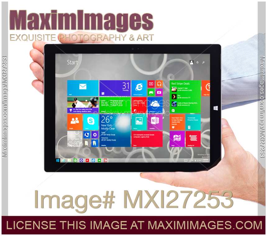 Person hands holding Microsoft tablet Surface Pro 3