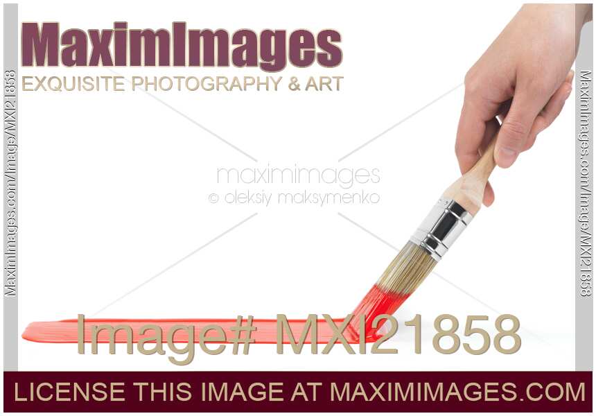 Person Painting with a Brush Dipped in Red Paint