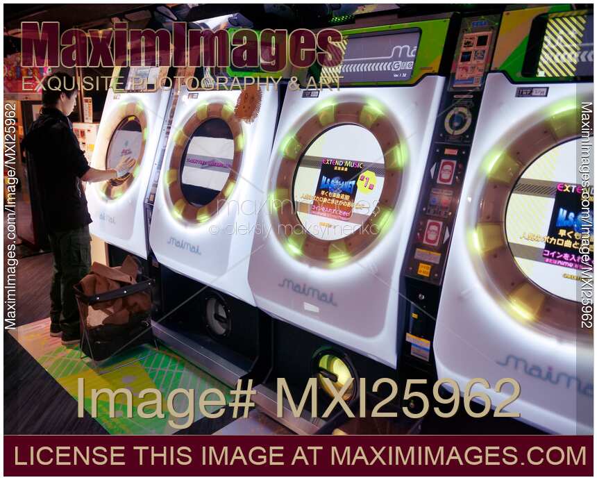 Person playing at an arcade in Japan