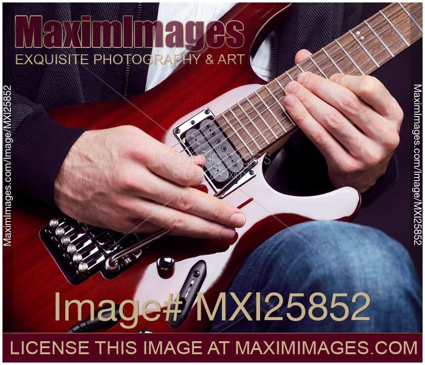 Person playing electric guitar