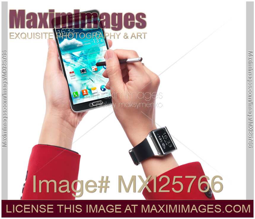 Person with Samsung Galaxy Note III smartphone and Galaxy Gear watch