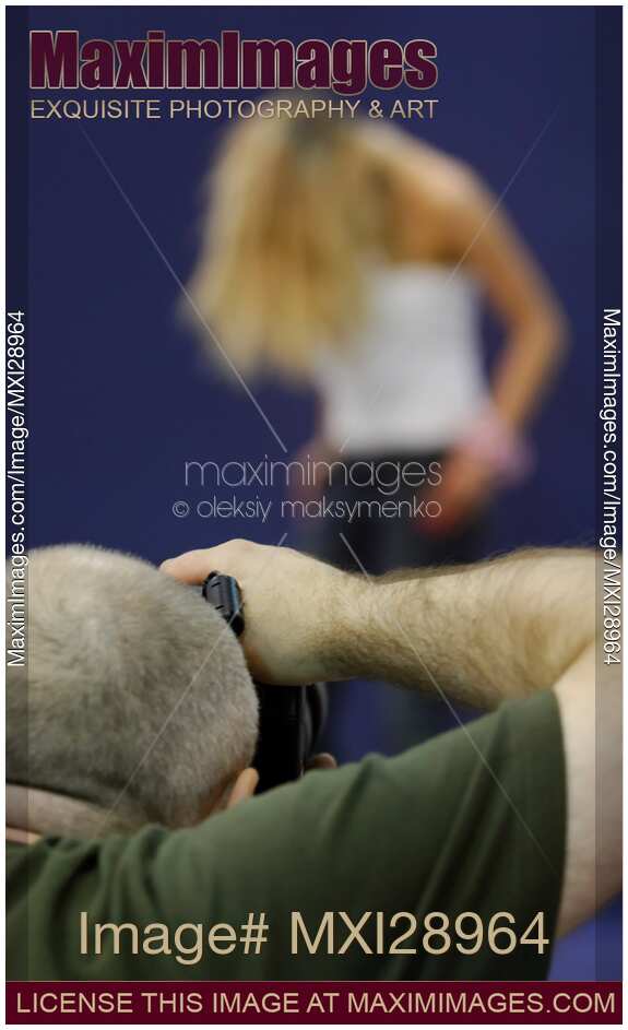 Photographer Taking Pictures of a Model