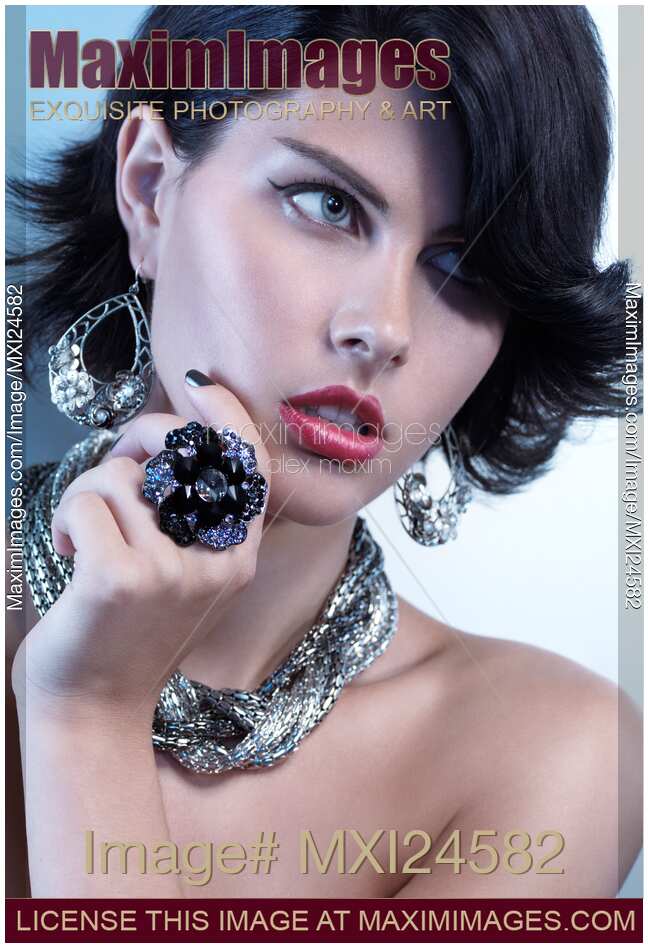 Stock photo Portrait of a Beautiful Woman Wearing Jewelry MaximImages