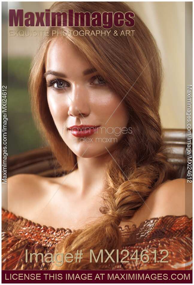 Portrait of a beautiful young woman with a braid
