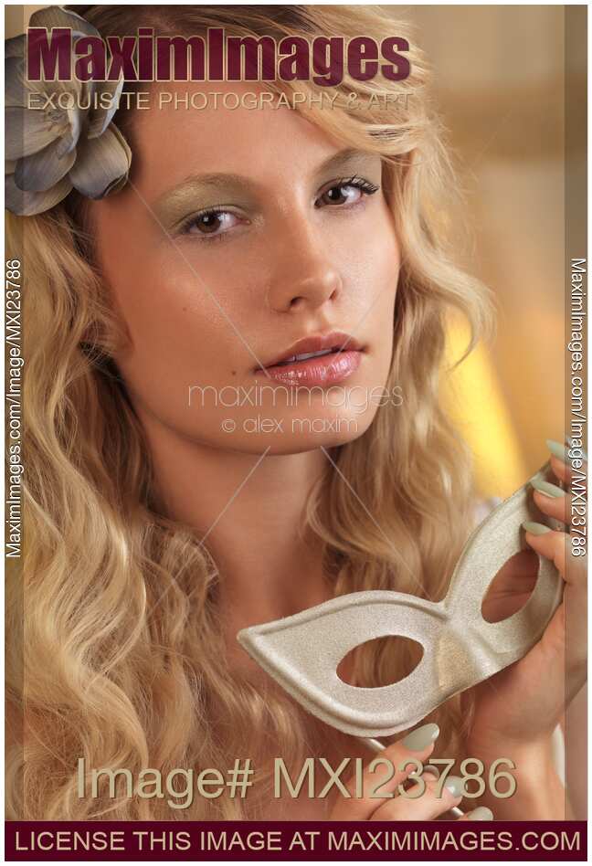 Portrait of a Beautiful Young Woman with a Mask