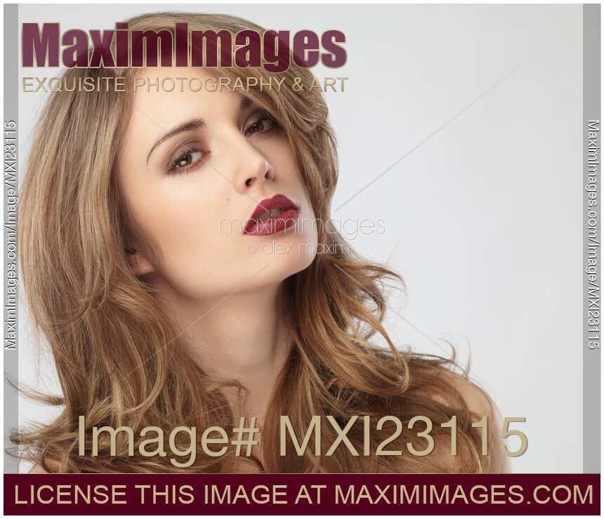 Portrait of a Beautiful Young Woman with Glamorous Hair