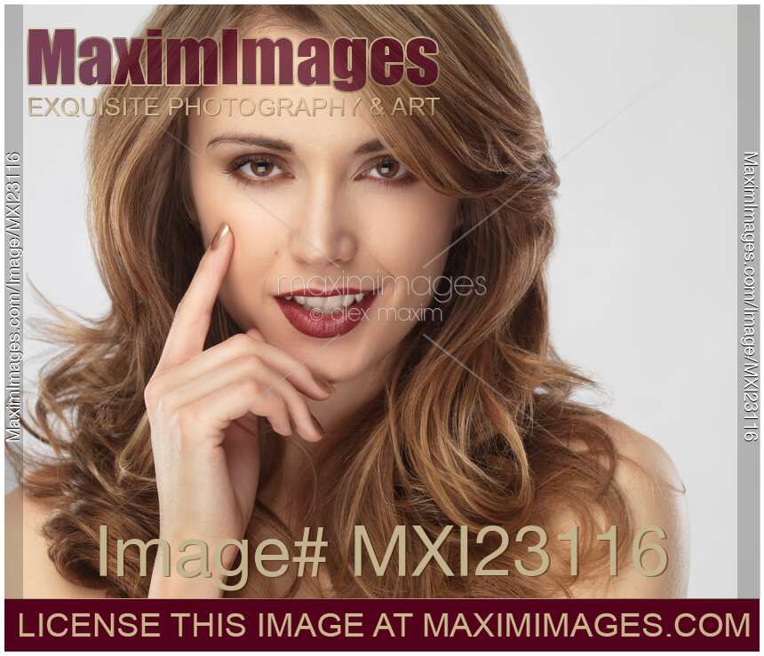 Portrait of a Beautiful Young Woman with Glamorous Hair