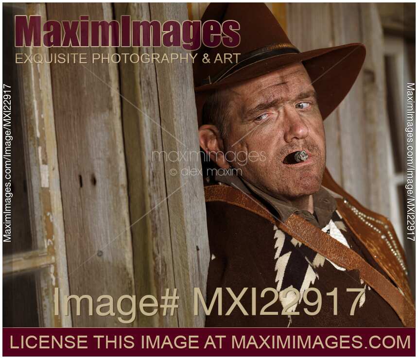 Portrait of a Cowboy Smoking a Cigar