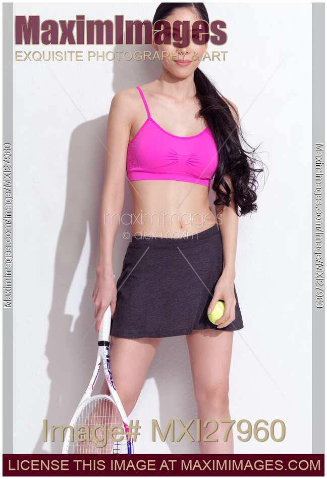 Portrait of an asian woman with a tennis racket