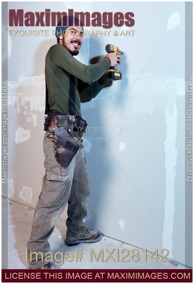 Portrait of man contractor worker mounting drywall
