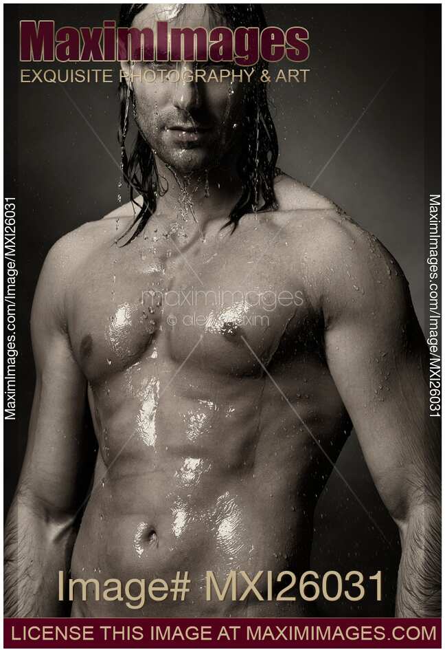 Portrait of man with wet bare torso standing under shower Black an white