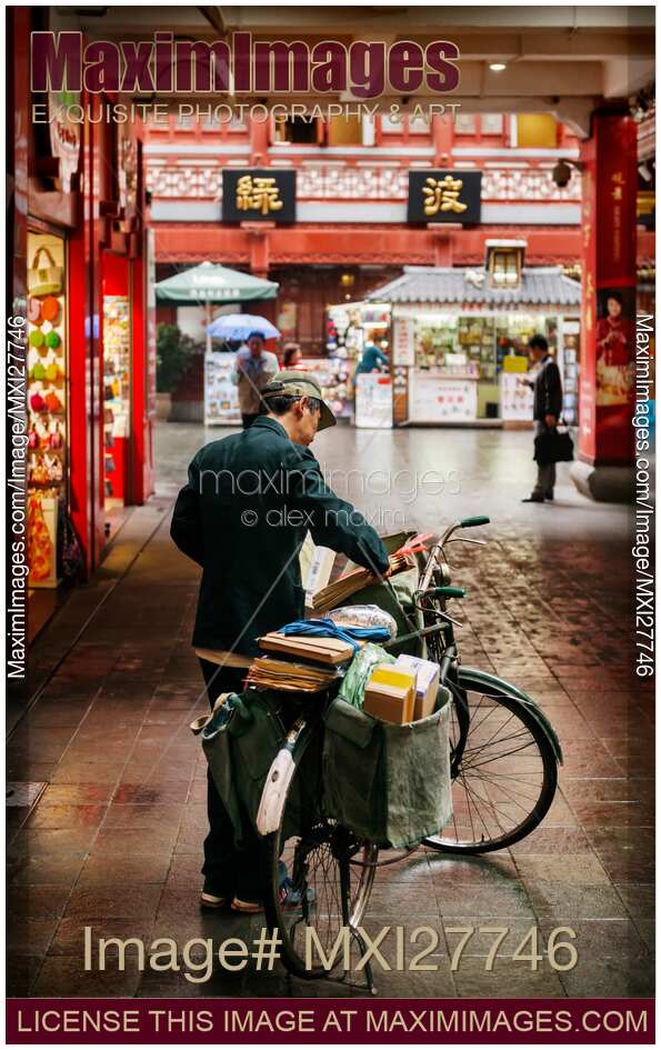 Postman in the Old city of Shanghai China