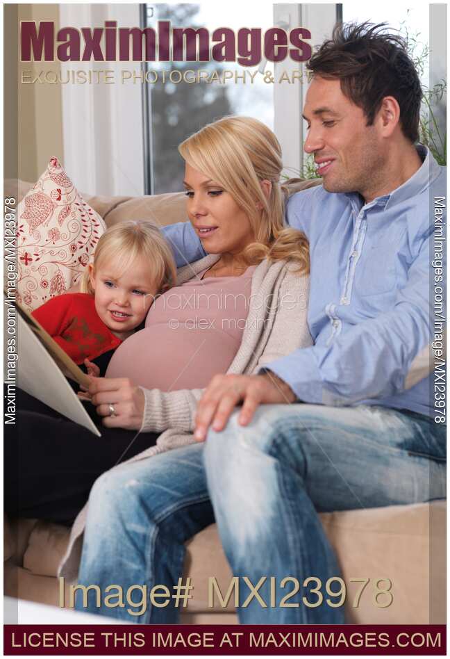 Pregnant Mother Her Husband and Daughter Together at Home