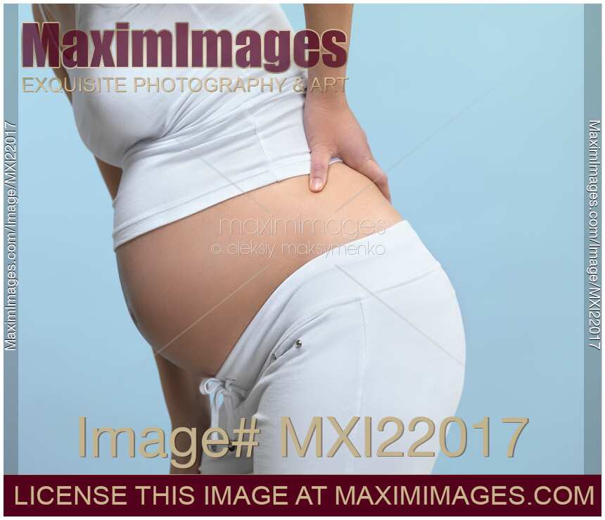 Pregnant Woman Rubbing Her Back