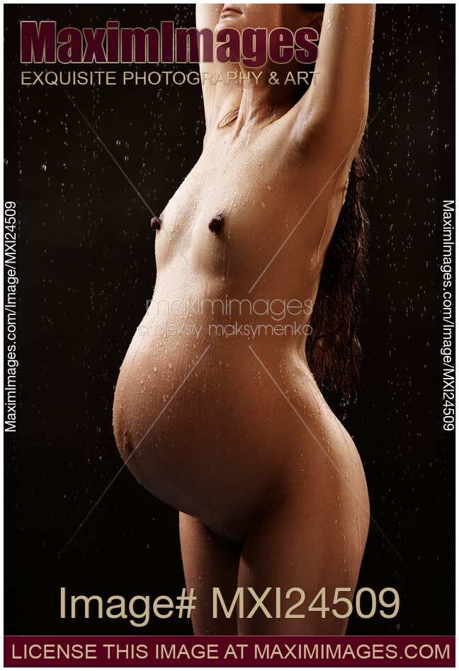 Pregnant Woman Standing in the Rain