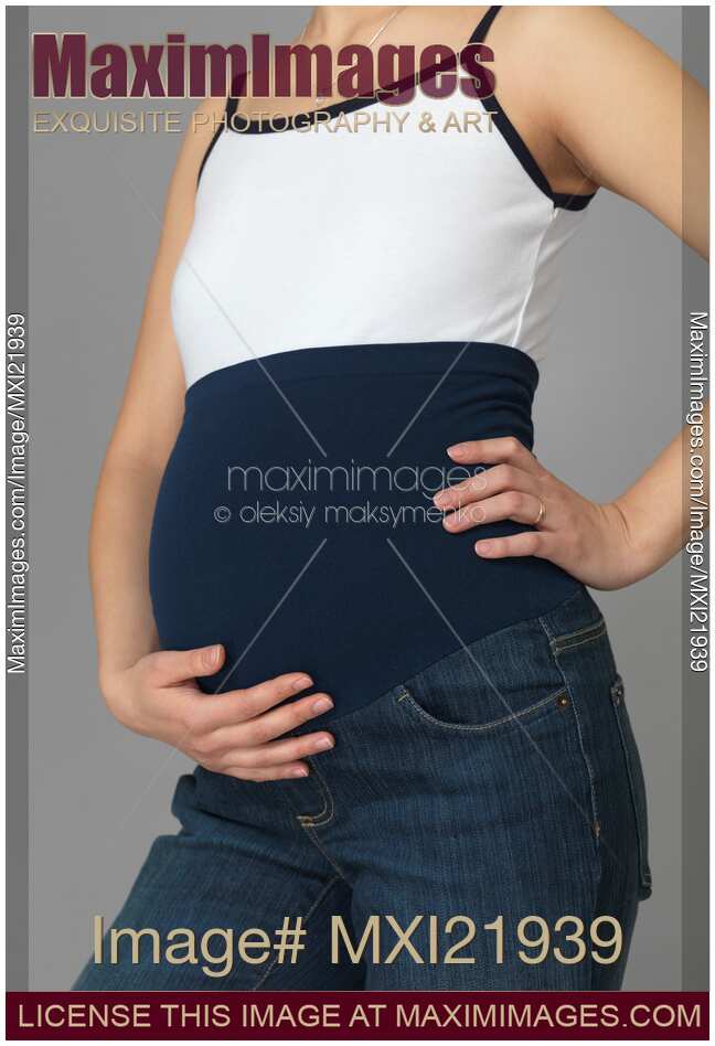 Photo of Pregnant Woman Wearing Maternity Jeans Stock Image MXI21939
