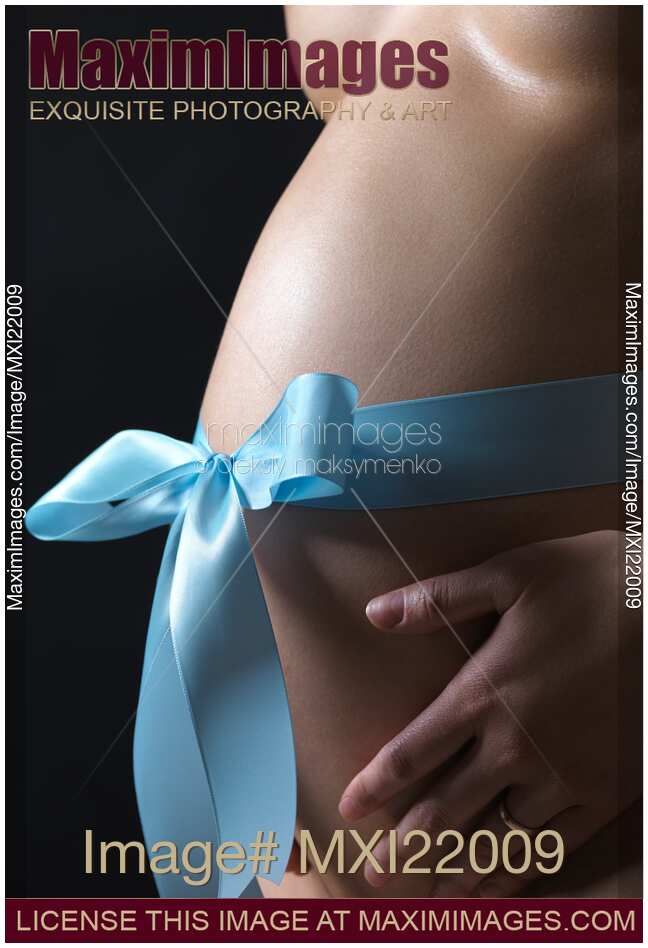 Pregnant Woman with a Bow on Her Belly