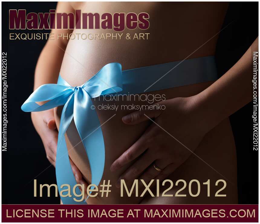 Pregnant Woman with a Bow on Her Belly