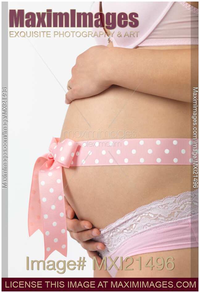 Pregnant Woman with a Pink Bow on Her Belly