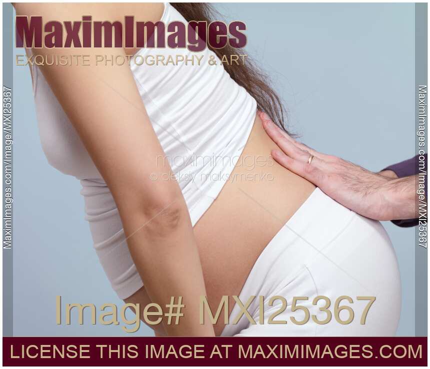 Pregnant woman with back pain getting massage
