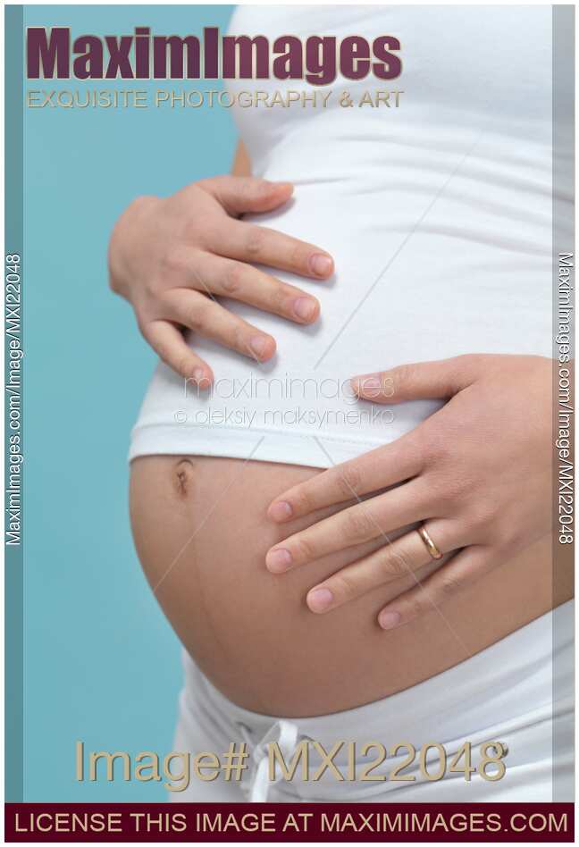 Pregnant Woman with Hands Around Her Belly