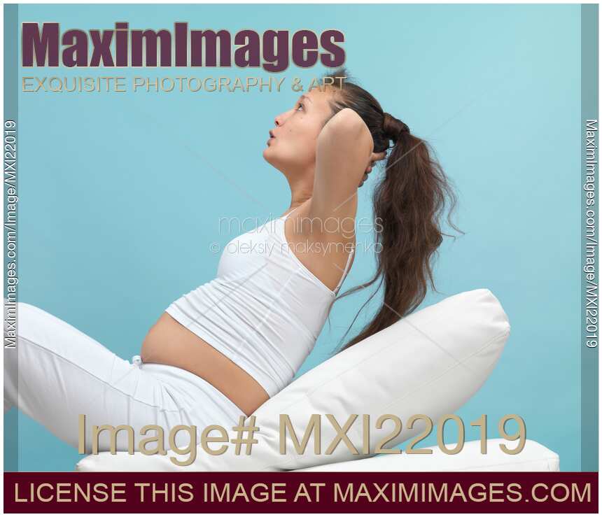 Pregnant Young Woman Exercising