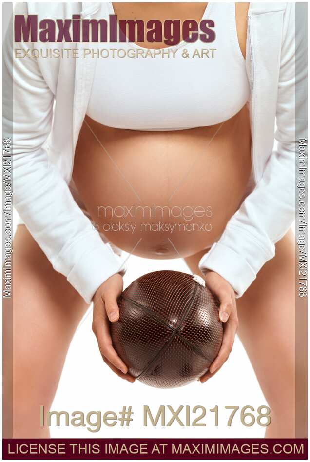 Pregnant Young Woman with a Football