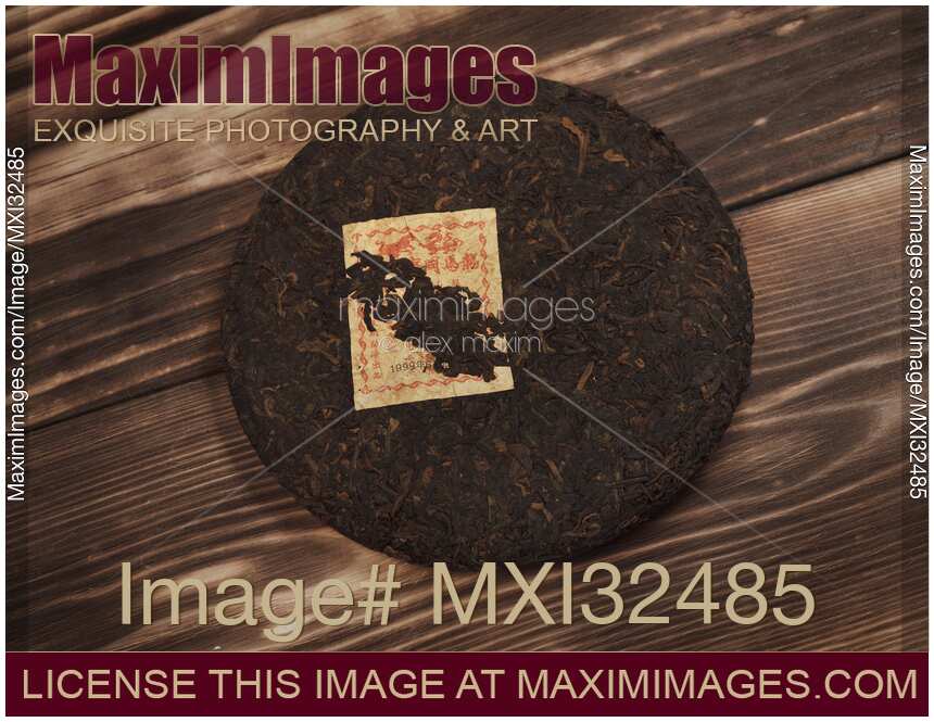 Pu'er or Pu-erh fermented Chinese ripened black tea still life Puer Bingcha