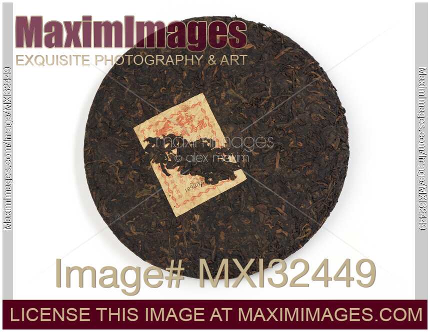 Pu'er or Pu-erh fermented Chinese tea aged for over 20 years pressed into a round disc shape Bingcha