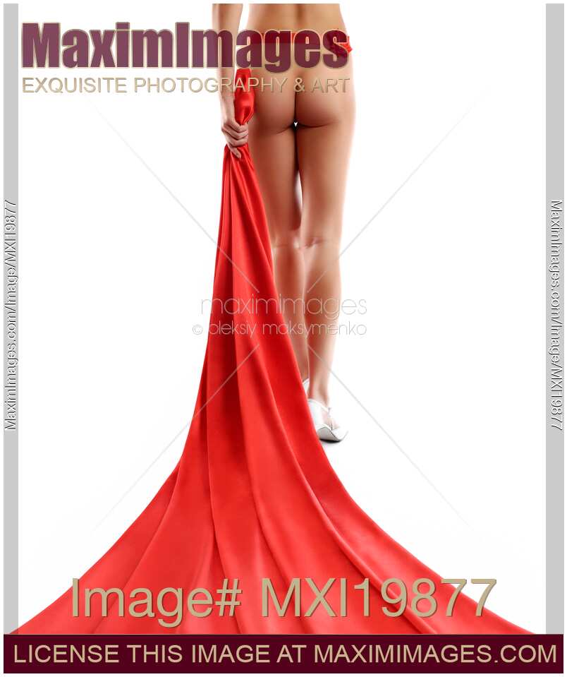 Red fabric behind naked woman legs
