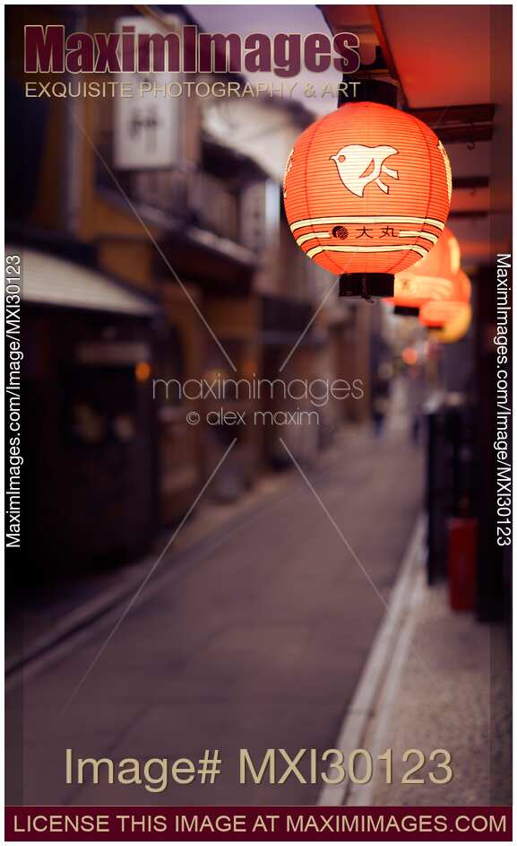 Red Japanese restaurant lantern lit up at night in Kyoto