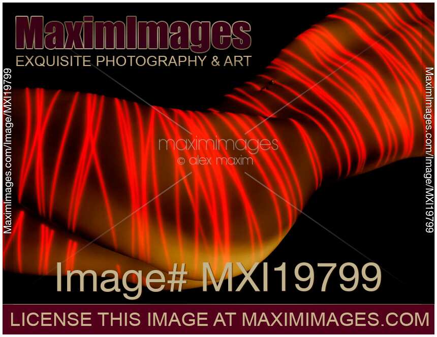 Red laser over nude woman body