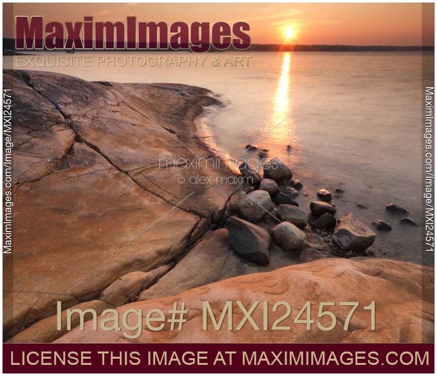 Red rocks on a shore of Georgian Bay during sunrise